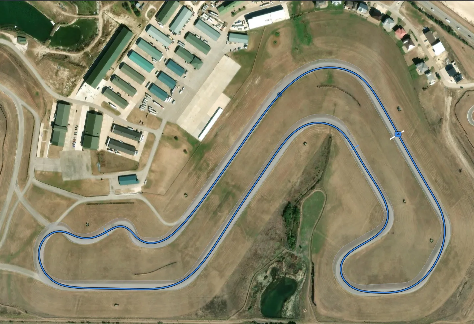 Racing lines over satellite imagery, coloured per lap